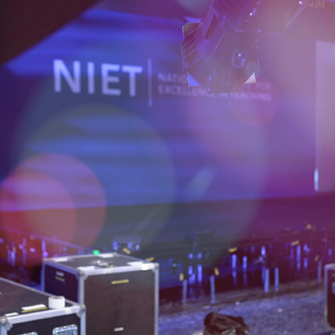 Image of travel boxes with lighting and audio tech parts before an event